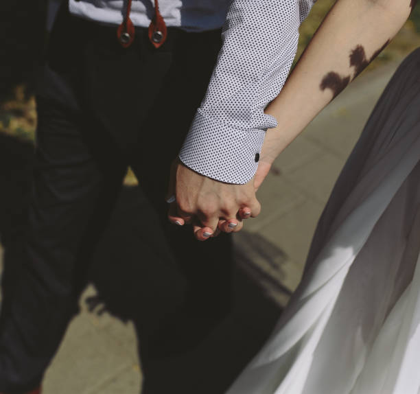 istock bride and groom walking around the city 538901726