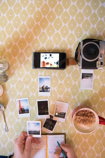 Photographer cataloguing his work in a cafe. ALL PICTURES ARE MY COPYRIGHT.