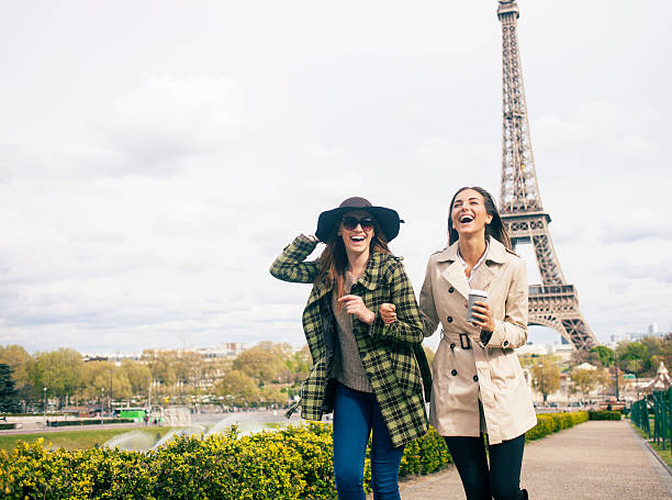 istock Cheerful young women having fun in front of Eiffel Tower 538903094