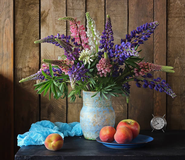 istock Still life with lupins and peaches in a rustic style. 538903314