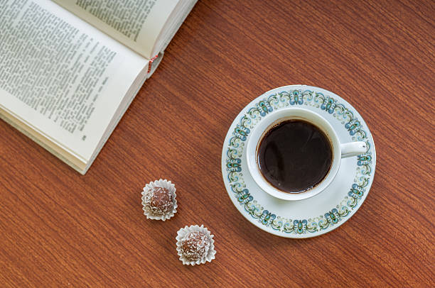 istock Cup of coffee, cake and book 538903397