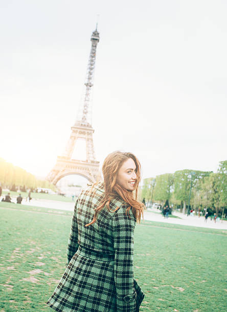 istock Smiling young woman posing in front of Eiffel tower 538903534