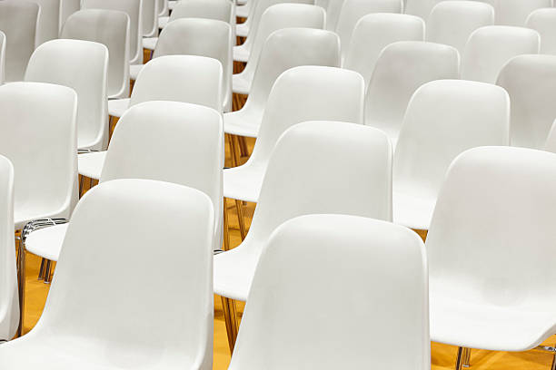 istock Conference room with plastic chairs detail and yellow floor. 538903788