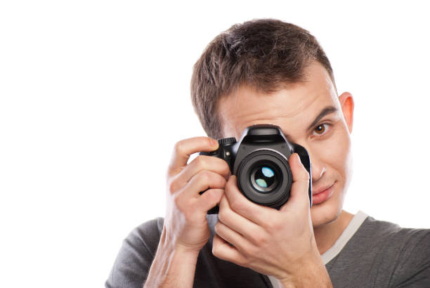 istock male photographer with camera isolated on white 538904444
