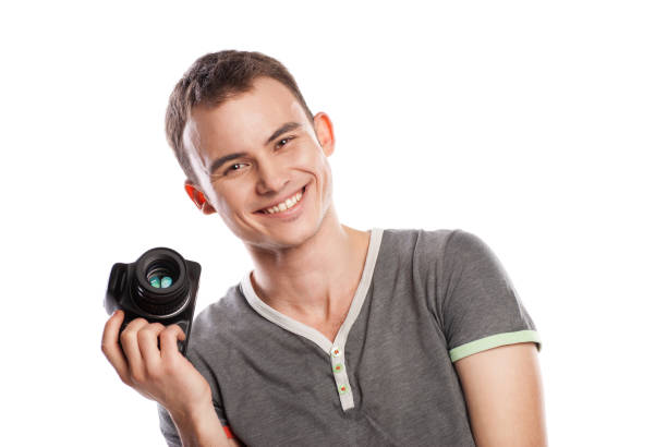 istock male photographer with camera isolated on white 538904524