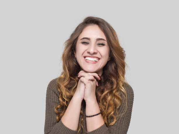 istock Happy young woman praying 538904790
