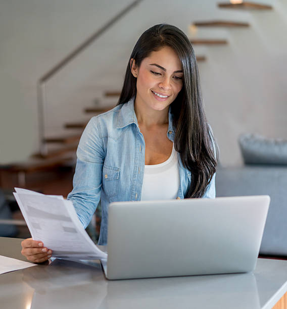 istock Woman paying bills online at home 538904812