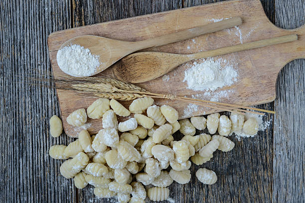istock Gnocchi on Cutting Board and Rustic Wood Background 538904933