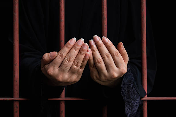 istock Muslim woman hand in jail 538907518