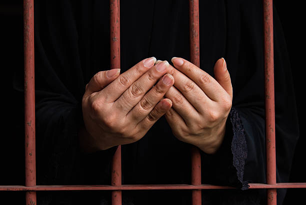istock Muslim woman hand in jail 538907588
