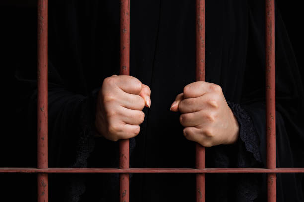 istock Muslim woman hand in jail 538907644