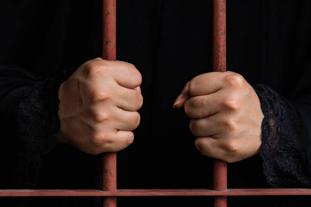 istock Muslim woman hand in jail 538907706