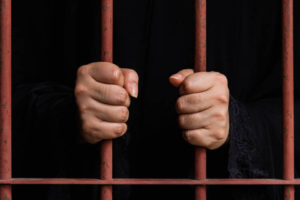 Muslim woman hand in jail
