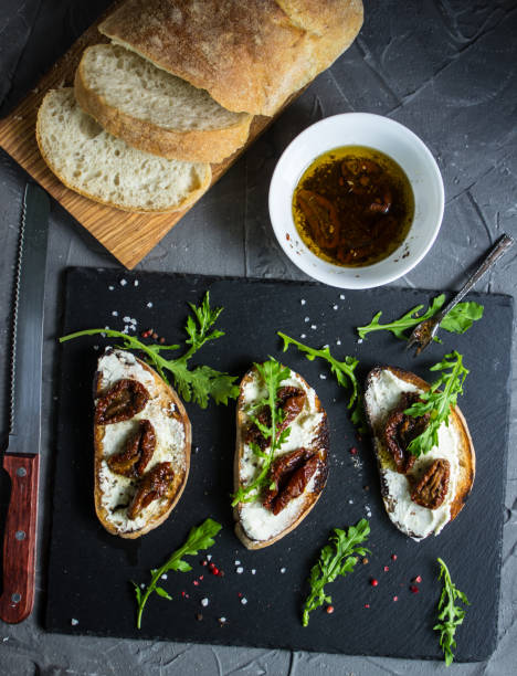 istock Sandwich with cheese and half dried tomatoes. 538908662
