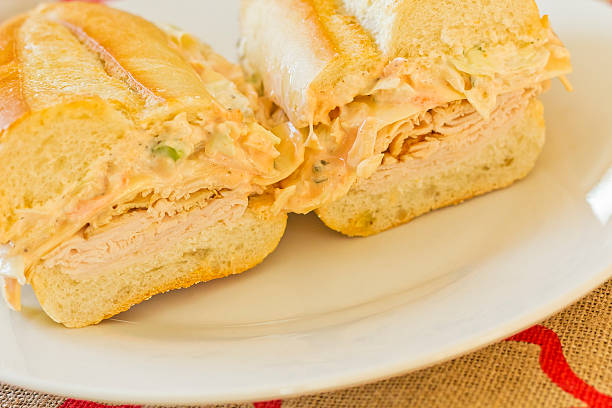 Turkey Reuben Healthy alternative, turkey reuben on a torpedo roll with cole slaw dressing torpedo sandwich stock pictures, royalty-free photos & images