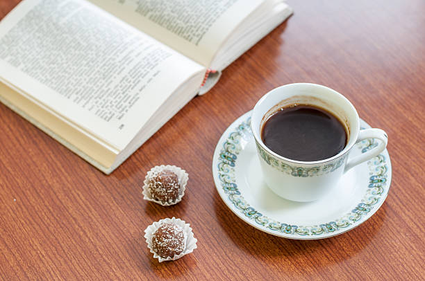 istock Cup of coffee, cake and book 538915463