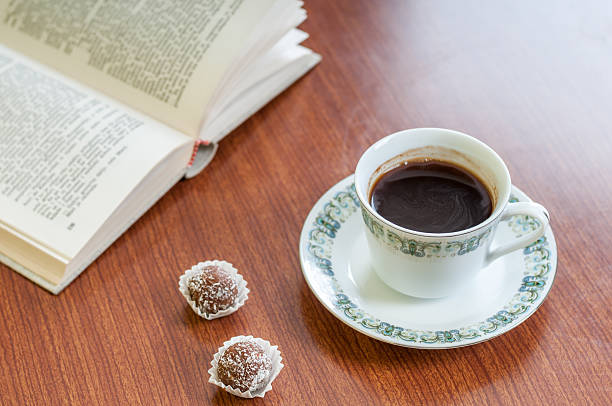 istock Cup of coffee, cake and book 538915469