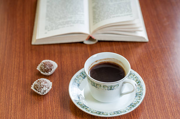 istock Cup of coffee, cake and book 538915517