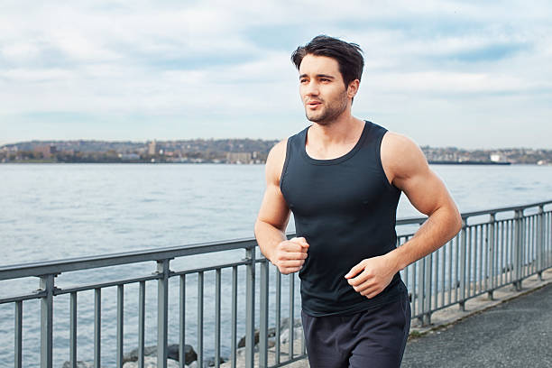 istock Healthy young man running outdoors 538916195