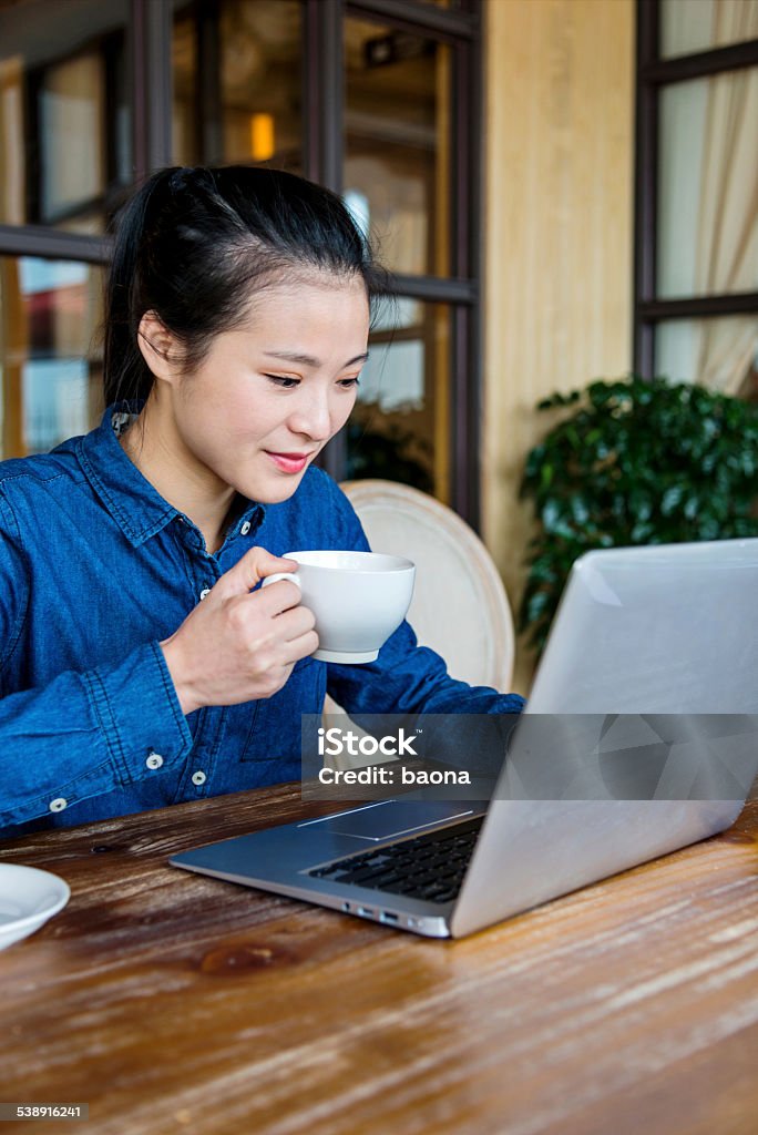 business working Beautiful young businesswoman working with laptop at office. Using Computer Stock Photo