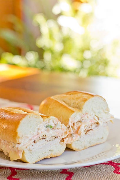 Turkey Reuben Healthy alternative, turkey reuben on a torpedo roll with cole slaw dressing torpedo sandwich stock pictures, royalty-free photos & images