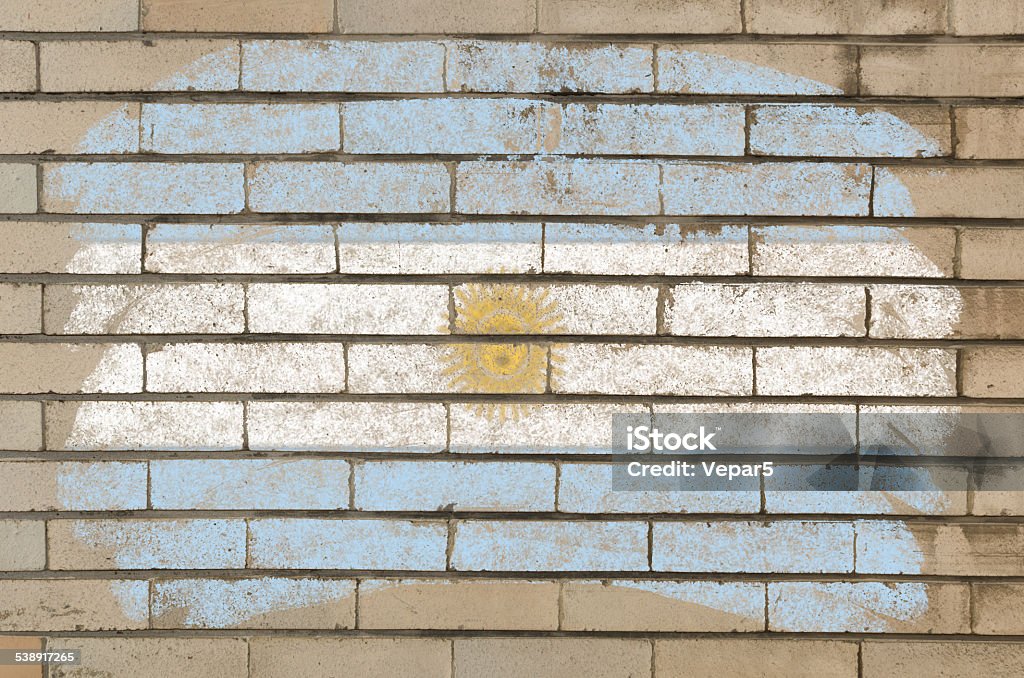 flag of Argentina on grunge brick wall painted with chalk Chalky argentinian flag painted with color chalk on grunge old brick wall 2015 Stock Photo