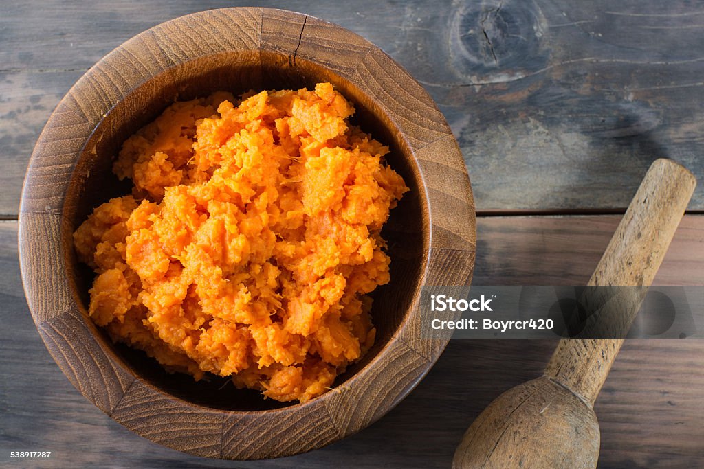 Bowl of mashed sweet potato A bowl of orange organic mashed sweet potato vegetable. Mash - Food State Stock Photo