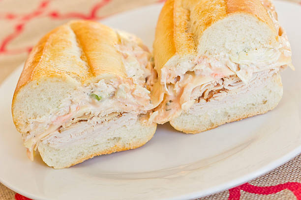 Turkey Reuben Healthy alternative, turkey reuben on a torpedo roll with cole slaw dressing torpedo sandwich stock pictures, royalty-free photos & images