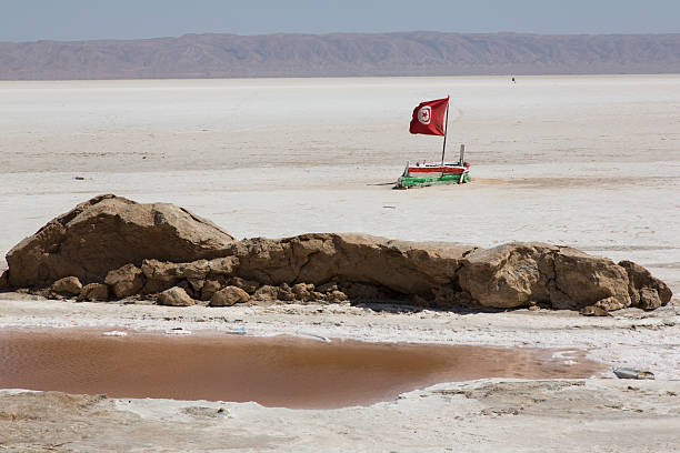 Salt lake Tunisa boat and Tunisian flag