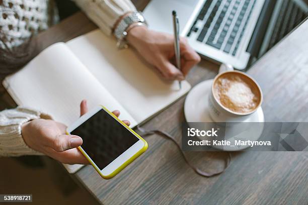 Woman Hands With Pen And Notepad Smartphone Coffee Stock Photo - Download Image Now