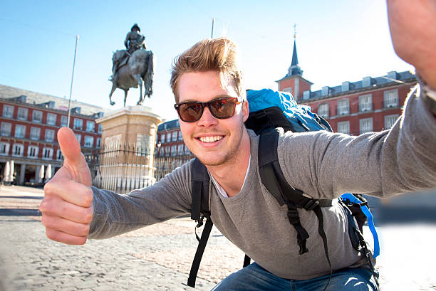 istock student backpacker tourist taking selfie photo with stick and mobile 538918907
