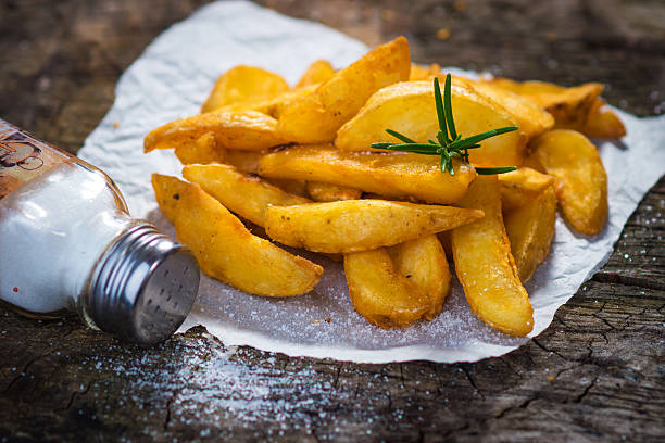 Potato Wedges Potato Wedges too much salt stock pictures, royalty-free photos & images