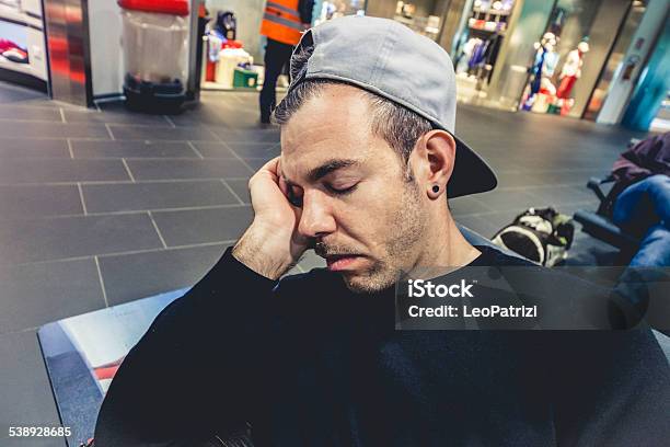 Young Man Sleeping In The Airport Lounge Stock Photo - Download Image Now - 2015, Adult, Airplane