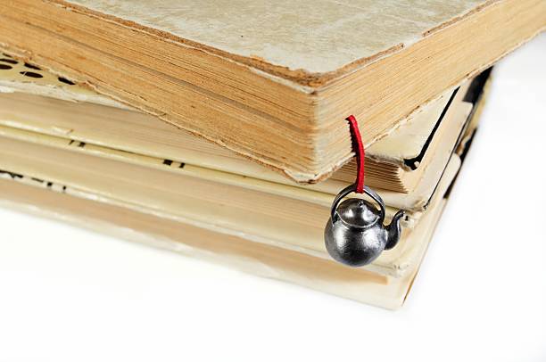istock Stack of used books with a hand-made bookmark 538929743