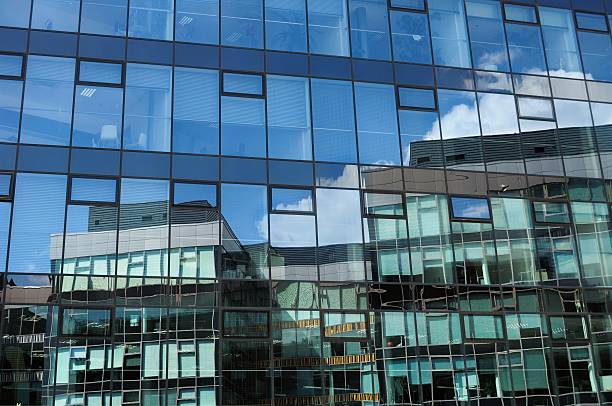istock Reflection in glass wall of modern office building 538929763