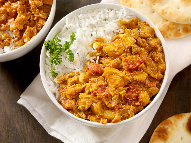 Chicken tikka masala Chicken tikka masala with Basmati Rice and Naan Bread -Photographed on Hasselblad H1-22mb Camera chicken curry stock pictures, royalty-free photos & images