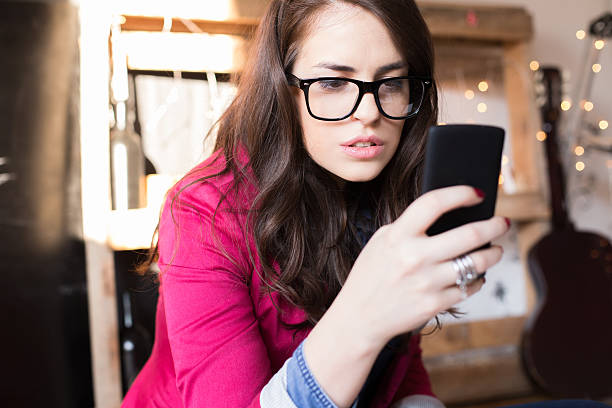 istock Young beautiful hipster woman using smart phone at office 538947733