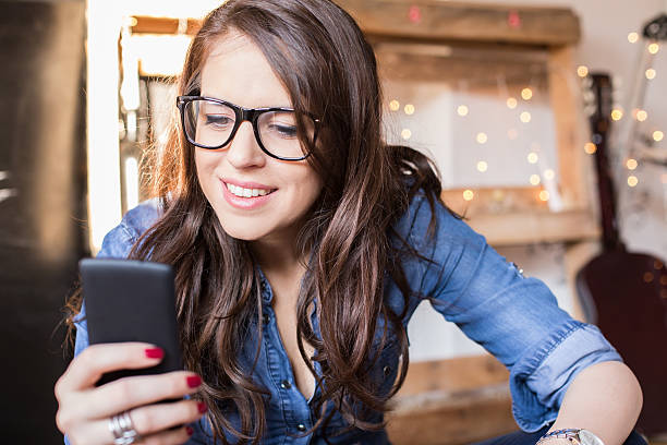 istock Young beautiful hipster woman using smart phone at office 538947739