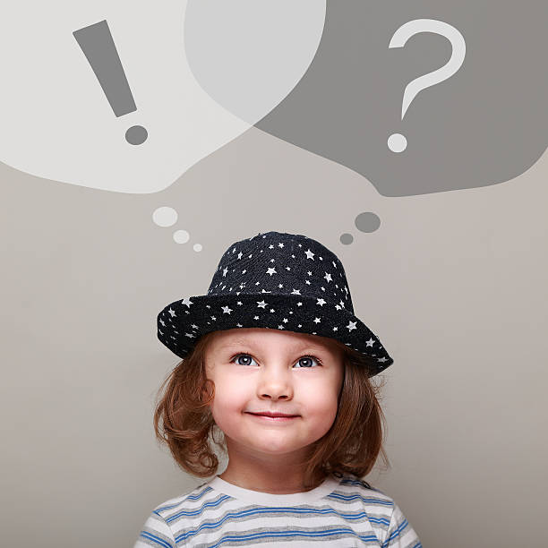 istock Thinking happy kid girl looking up on question and exclamation 538948369