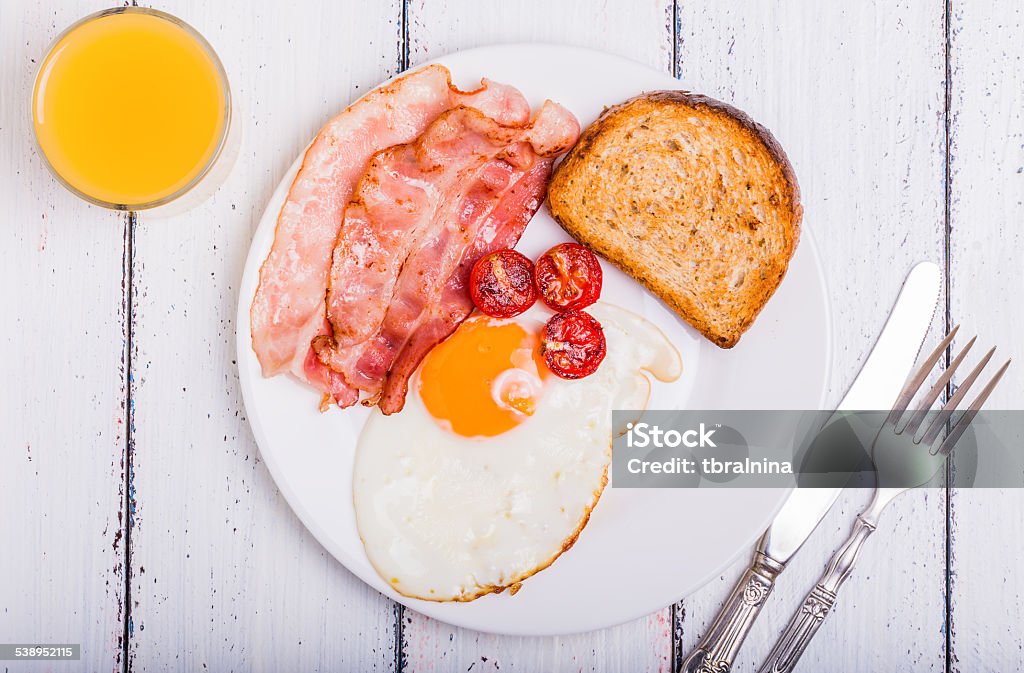 Bacon and Eggs tasty dish with the traditional bacon and eggs served with toast 2015 Stock Photo