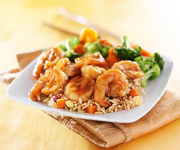 shrimp and fried rice teriyaki dish shot with selective focus