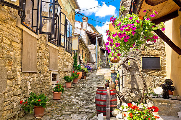 Town of Hum colorful old stone street Town of Hum colorful old stone street, Istria, Croatia istria photos stock pictures, royalty-free photos & images