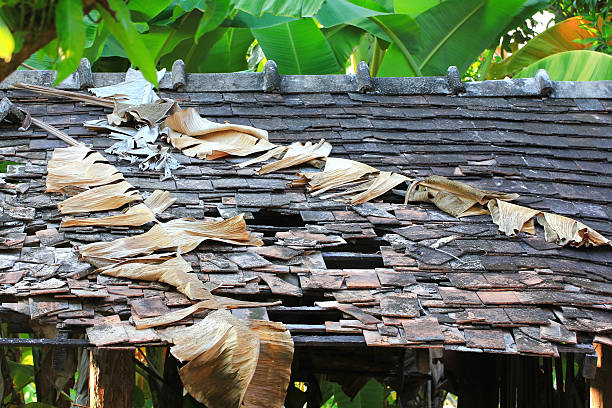 istock Damaged asbestos roofing material due to storm or decay 538981099