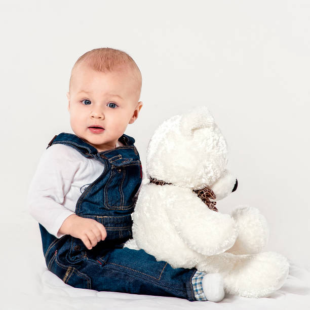 istock the little boy plays with a teddy bear 538981168