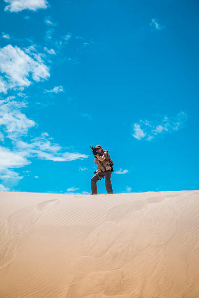 istock Special Operations Officer Shooting From A Sand Hill 538981177