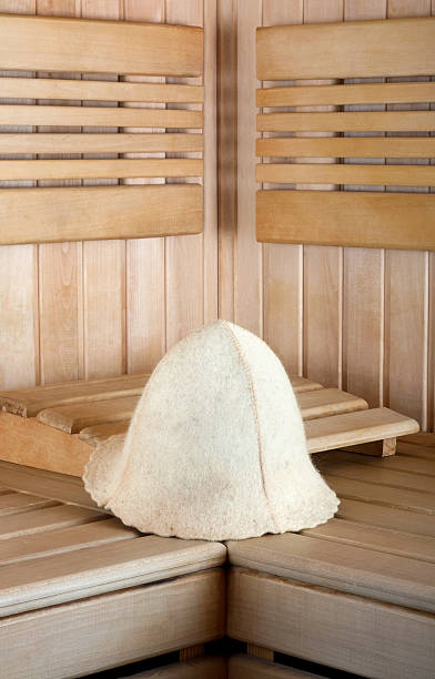 istock Traditional wooden sauna for relaxation with felt hat 538981917