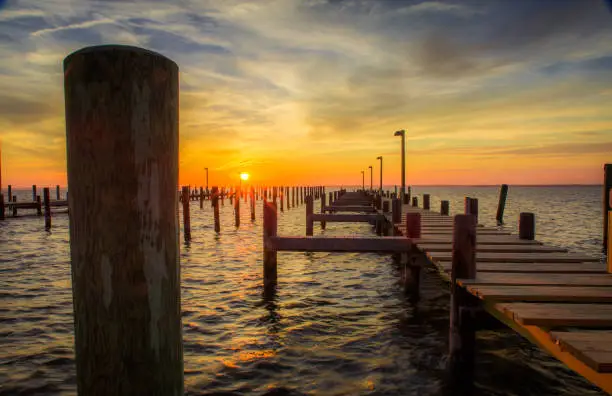 Sunset in Seaside Heights, NJ looking towards Toms River, overlooking a dock.