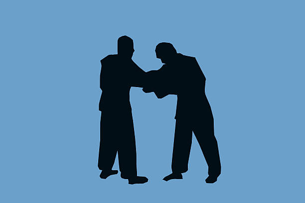 very vivid display, two men wrestling with each other, in a sizzling, University of Science and Technology Beijing gymnasium