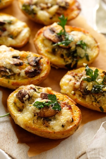 istock Potato skins loaded with mushrooms, onion, herbs and melted cheese 538983706