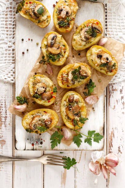 istock Potato skins loaded with mushrooms, onion, herbs and melted cheese 538984000